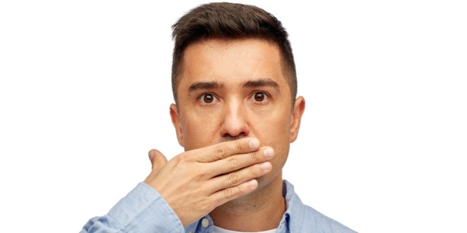 a man is closing his mouth