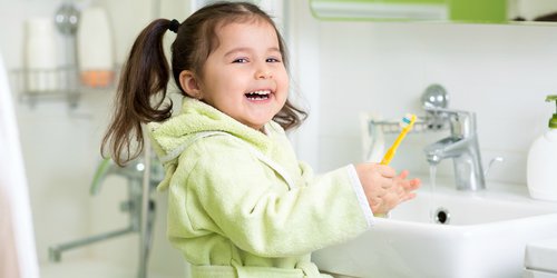 Daughter smiling after brushing her teeth