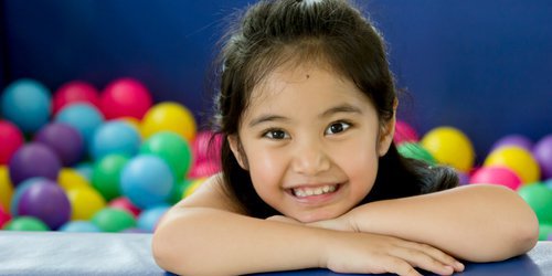 girls smile with healthy milk teeth